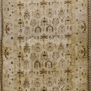 Ivory and gold runner rug with brown and red repeating stylized trellis designs.
