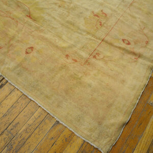 Antique Turkish Borlou Oushak rug with ivory field, large-scale floral palmettes, and soft pastel border, hand-knotted wool oversized carpet from the early 20th century