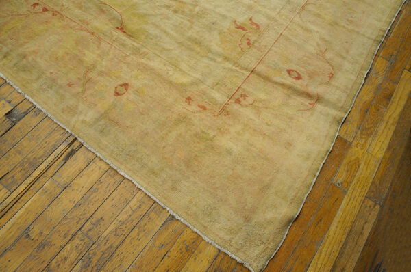 Antique turkish borlou oushak rug with ivory field, large-scale floral palmettes, and soft pastel border, hand-knotted wool oversized carpet from the early 20th century