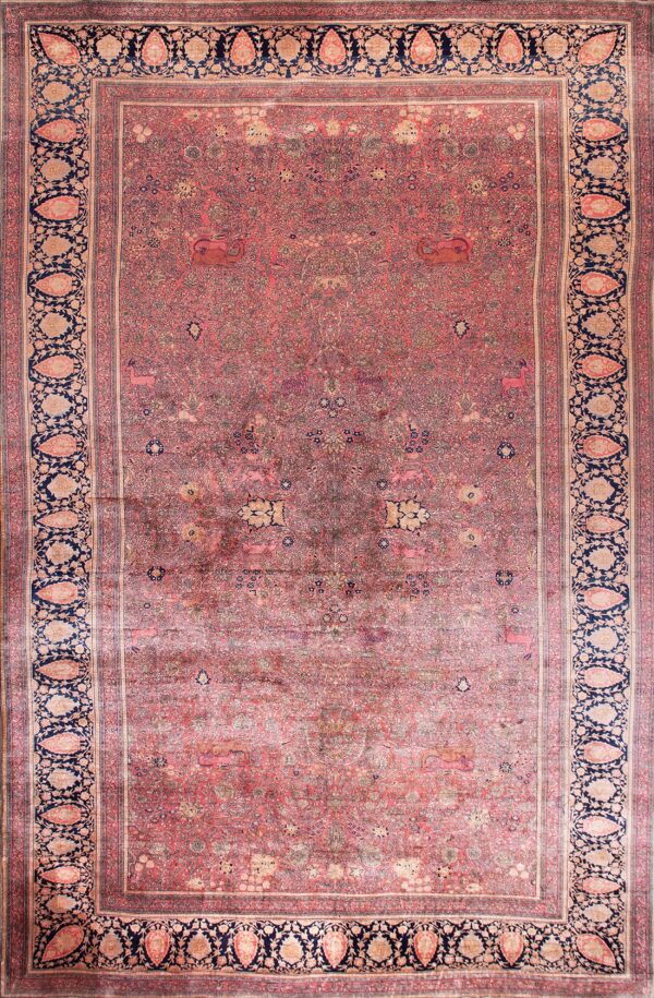 Rose field rug with deep navy borders featuring light boteh and detailed floral and animal patterns.