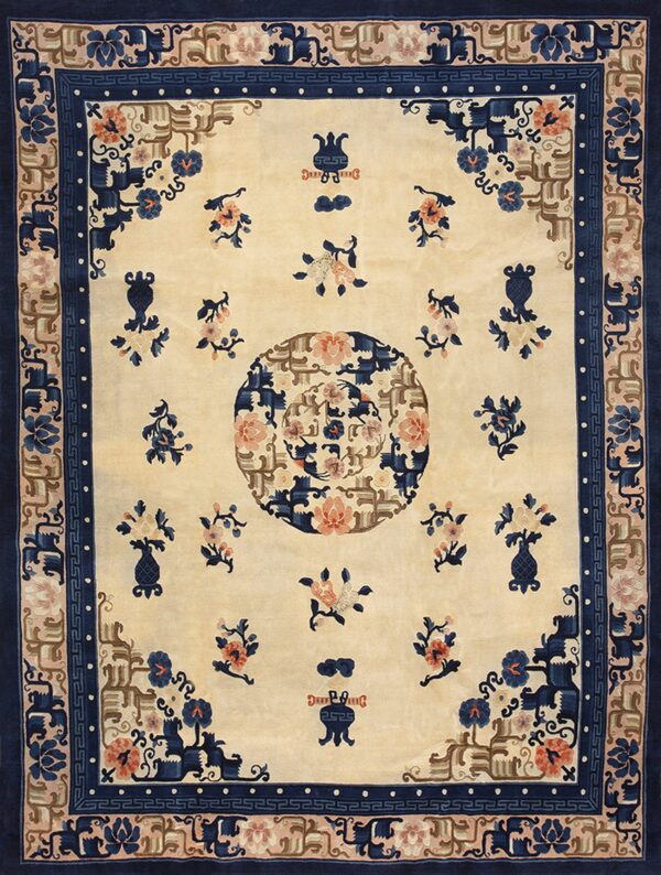 Beige rug featuring a large center medallion, navy border, and detailed blue and coral floral patterns.