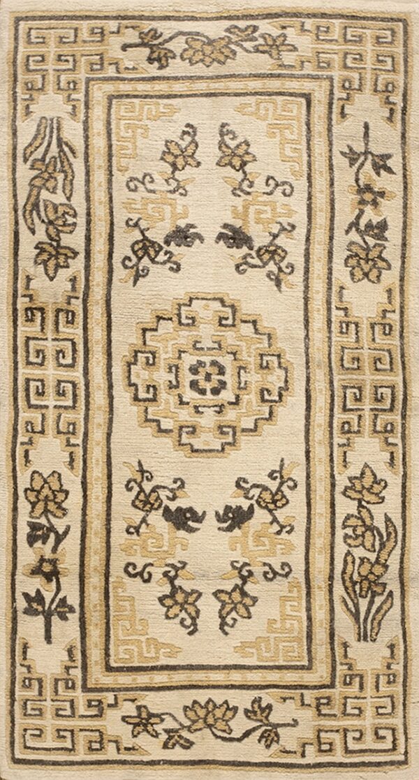 Cream rug featuring traditional geometric fretwork borders and floral patterns in contrasting tan and dark brown.