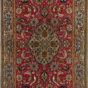 Red rug with an intricate central medallion, complex florals, and a gray border displaying running animals.