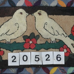 Low-pile hooked rug displaying two cream birds, red flowers, and a brown and tan background.