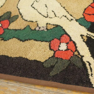 Low-pile looped rug featuring red flowers, green vines, and a white figure outline on a wood floor.