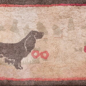 High-texture rug featuring a dark dog silhouette, pink flowers, a beige ground, and thick brown borders.