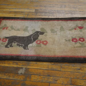 Beige textured rug featuring a brown dog silhouette, green foliage, and red floral accents on worn wood planks.