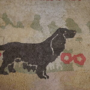 Textured loop pile rug featuring a dark dog silhouette among stylized red and green flora on a beige background.