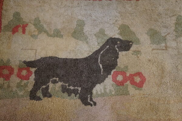 Textured loop pile rug featuring a dark dog silhouette among stylized red and green flora on a beige background.