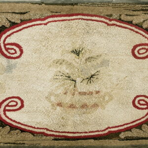 Highly textured rug displaying a cream medallion framed by red scrolls and olive green foliate designs.