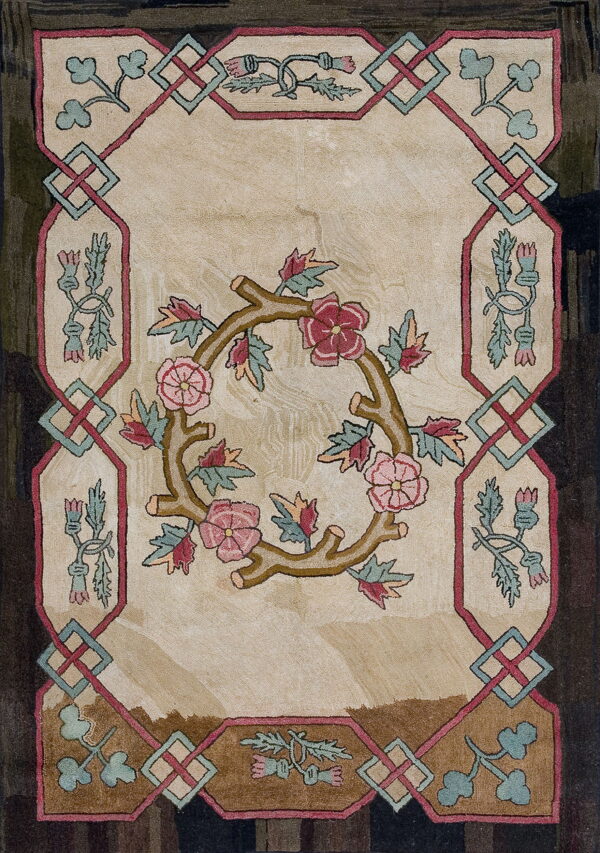 Cream and brown rug featuring a central rose wreath and an intricate border with teal and pink knots.