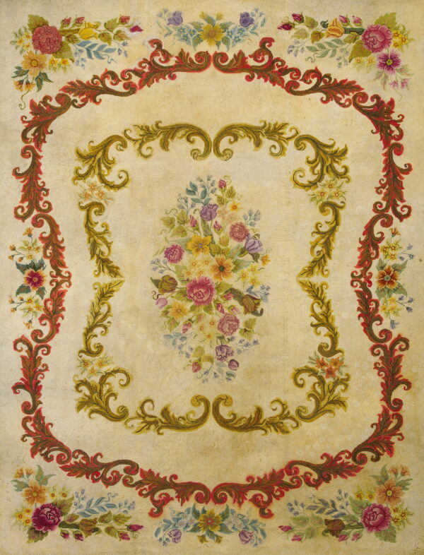 Ornate pale yellow rug with red and gold scroll borders framing a detailed multicolor floral design.