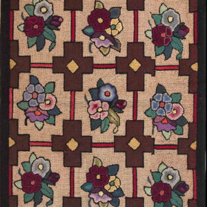 Hooked runner rug displaying colorful floral bouquets set inside a tan background and dark brown geometric grid.
