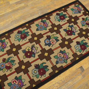 Tan and brown runner rug featuring vibrant floral clusters within a geometric pattern on light wood flooring.
