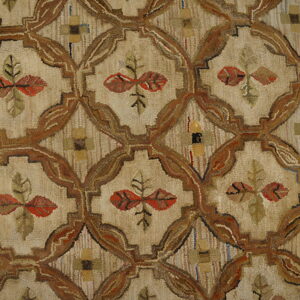 Muted, low-pile rug featuring a brown trellis pattern on beige, with rustic red and green leaf motifs.