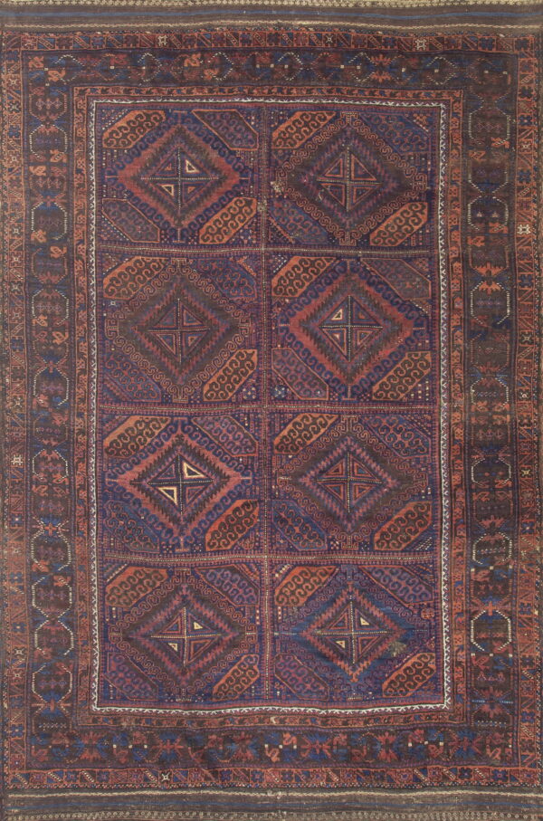 Intensely patterned low-pile rug with repeating geometric medallions in navy blue and reddish-brown.