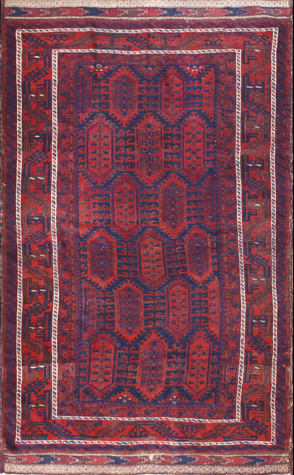 Geometric red and navy rug displaying repeating vertical medallions and complex dark borders with white accents.