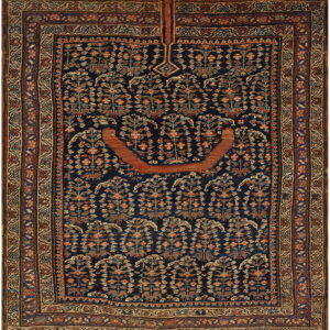 Dark blue prayer rug featuring repeating stylized floral motifs, a rust arch, and intricate borders.