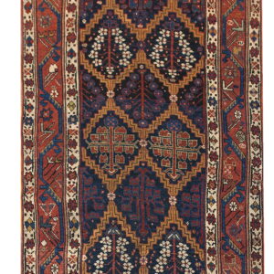 Geometric runner rug featuring stylized trees and diamond shapes in deep blue, rust red, and tan colors.