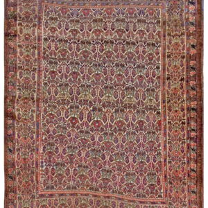 Low-pile rug with dense repeating motifs and multiple detailed borders in maroon, purple, and beige.