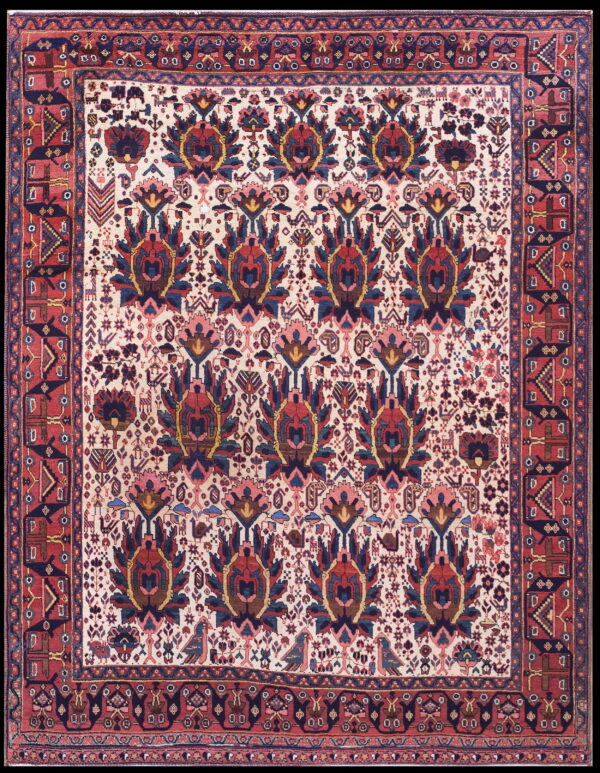 Traditional rug with an overall pattern of red and blue stylized palmettes on a cream background and red geometric borders.