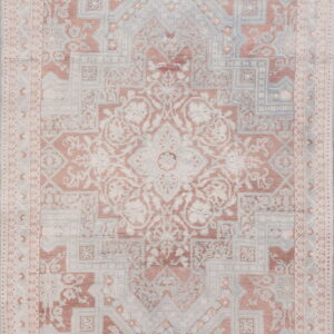 Distressed traditional rug with a central medallion pattern in faded rose, pale blue, and ivory tones.