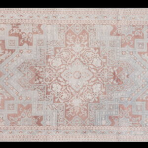Muted traditional rug with a central medallion and complex borders in rose, gray, and cream tones.