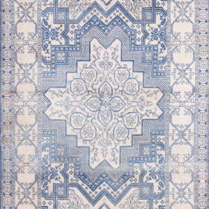 Cream and faded blue rug with geometric tribal patterns surrounding a large floral medallion.