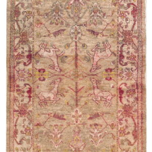 Faded, low-pile rug featuring stylized animals and botanicals in muted beige, red, pink, and yellow colors.