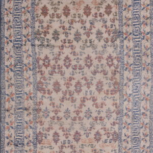 Cream runner rug featuring faded red and blue floral patterns framed by detailed blue geometric borders.