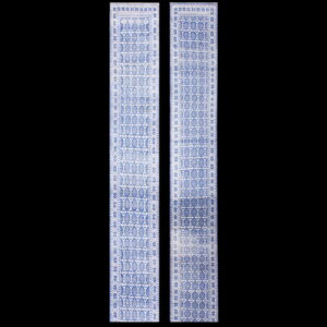 A pair of long blue and white runner rugs featuring intricate repeating medallion and star motifs.