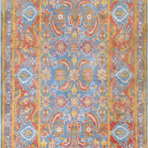 Distressed traditional rug with complex medallion and borders in contrasting blue, coral, and yellow.