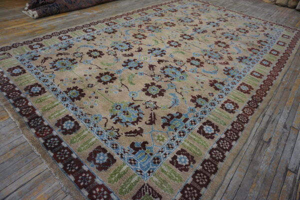 Beige high-pile rug featuring blue, brown, and green floral borders on rustic wooden planks.