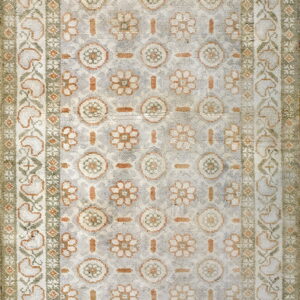 Distressed low-pile rug featuring light gray, orange, and sage stylized floral medallions and wide borders.