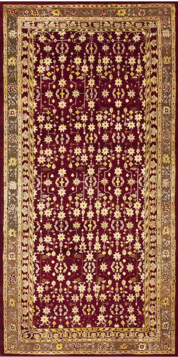 Maroon rug with dense gold star patterns and complex geometric borders in olive and yellow.