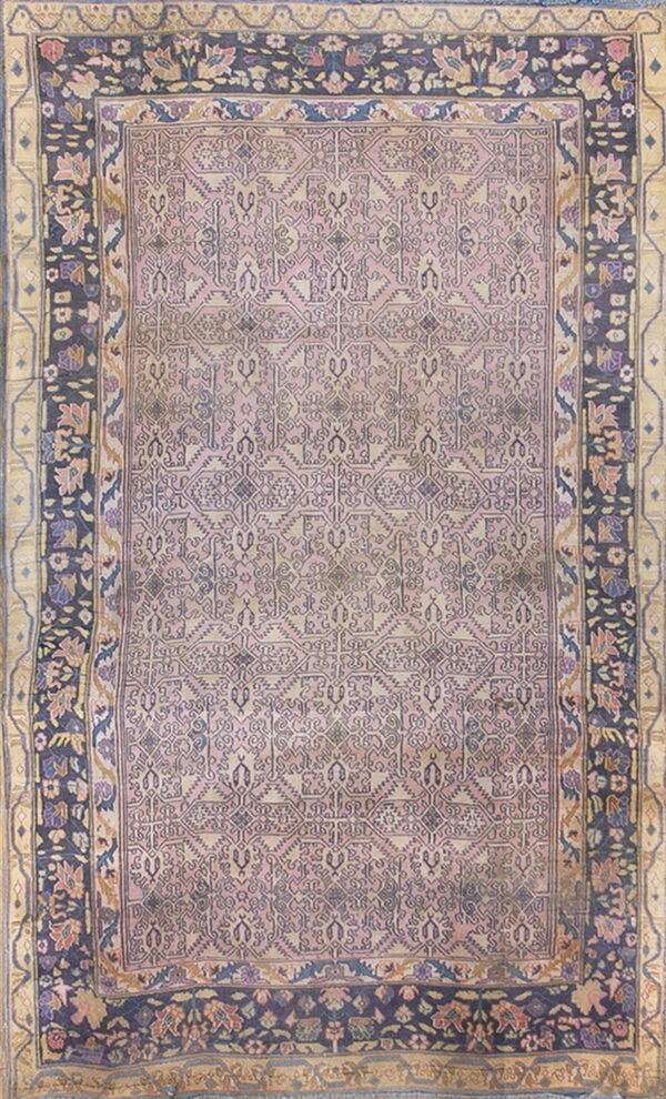 Mauve rug with a stylized geometric pattern and wide borders of dark blue and tan floral motifs.
