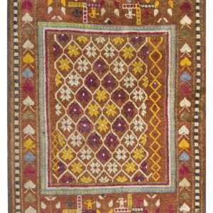 Earthy brown rug with colorful primitive designs, including figures, horses, and a central floral lattice pattern.