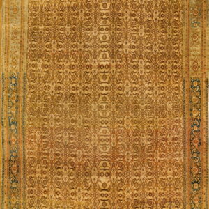 Large gold rug featuring a dense floral pattern framed by wide borders in teal and terracotta.