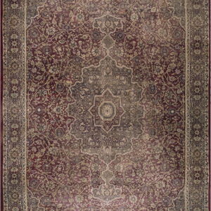 Deep red traditional medallion rug featuring intricate floral designs in faded beige and gray tones.