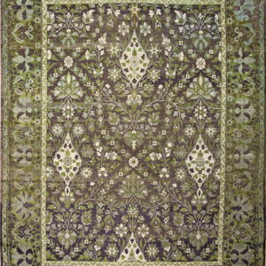Full view of a rug with a dense green and cream floral pattern on a dark purple background.