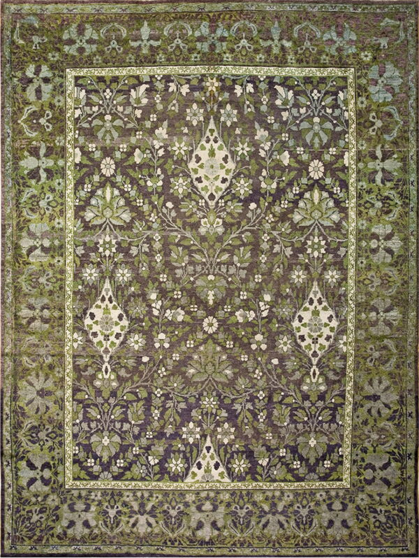 Full view of a rug with a dense green and cream floral pattern on a dark purple background.