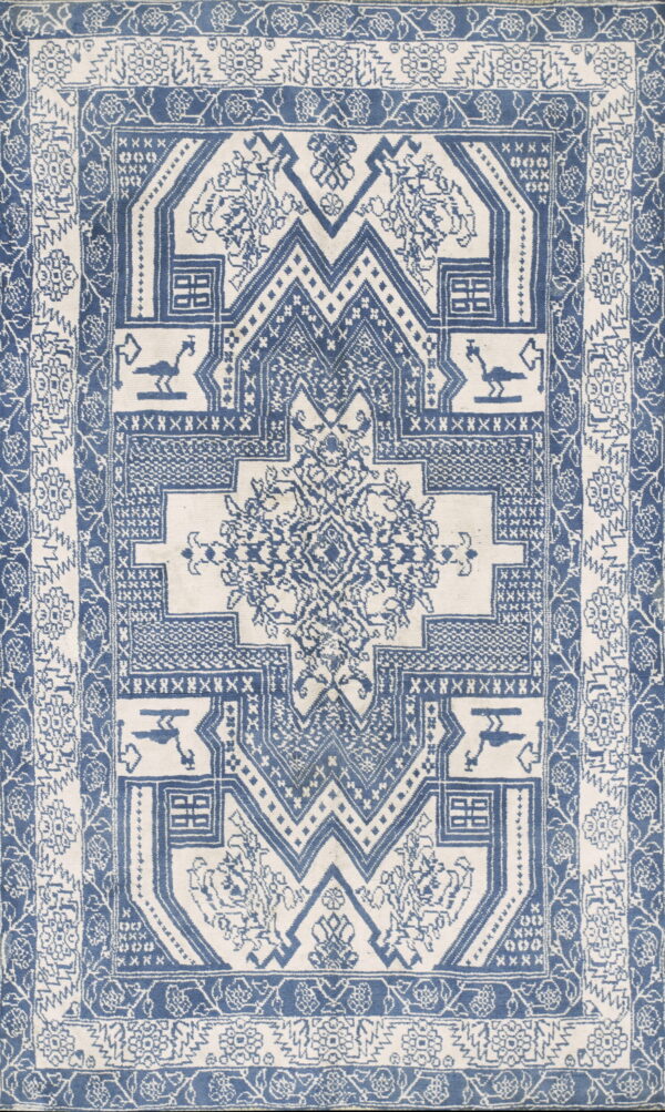 Blue and off-white woven rug featuring detailed borders and a central geometric medallion design.
