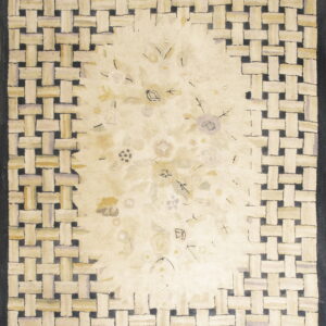 Cream rug with a woven lattice border in beige and dark gray surrounding a faint floral center design.