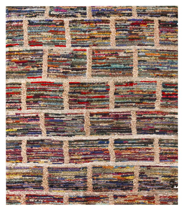 Close-up of a shaggy rug with a beige lattice pattern enclosing colorful horizontal stripes.