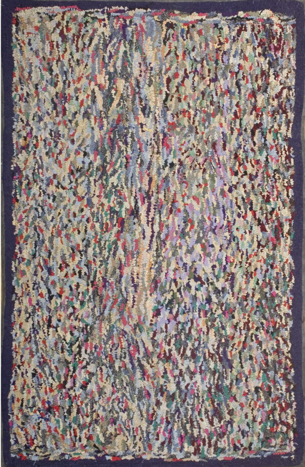A high-pile, multicolored abstract rug with textured strips of color and a solid dark purple border.