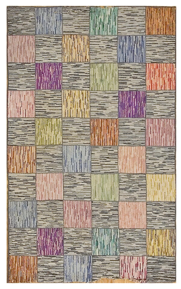 Patchwork rug with alternating squares of multicolored vertical stripes and horizontal gray-and-black striated texture.