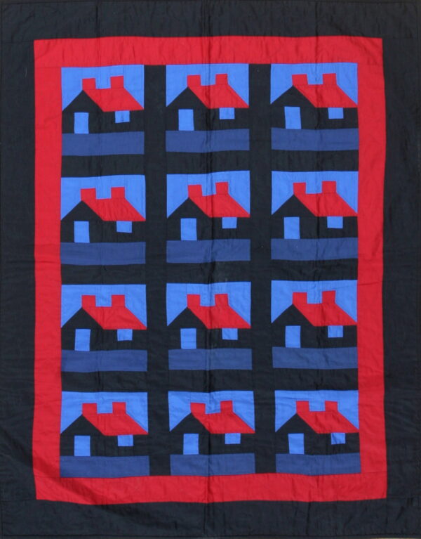 Flatweave textile featuring a black, blue, and red repeating house pattern bordered by solid red fabric.