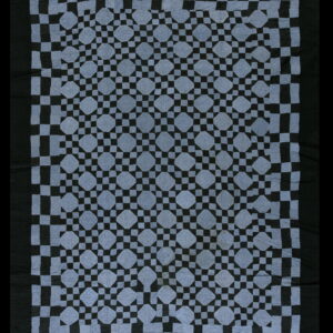 Slate blue and black textile featuring a repeating geometric star and lattice pattern with a wide solid border.