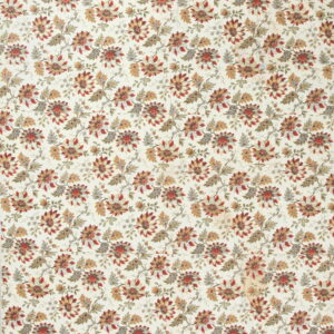 Cream rug with an all-over floral design featuring stylized red, rust, and sage leaves and blossoms.