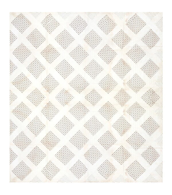 Cream rug featuring a geometric trellis of diamonds filled with small, dark paisley motifs.
